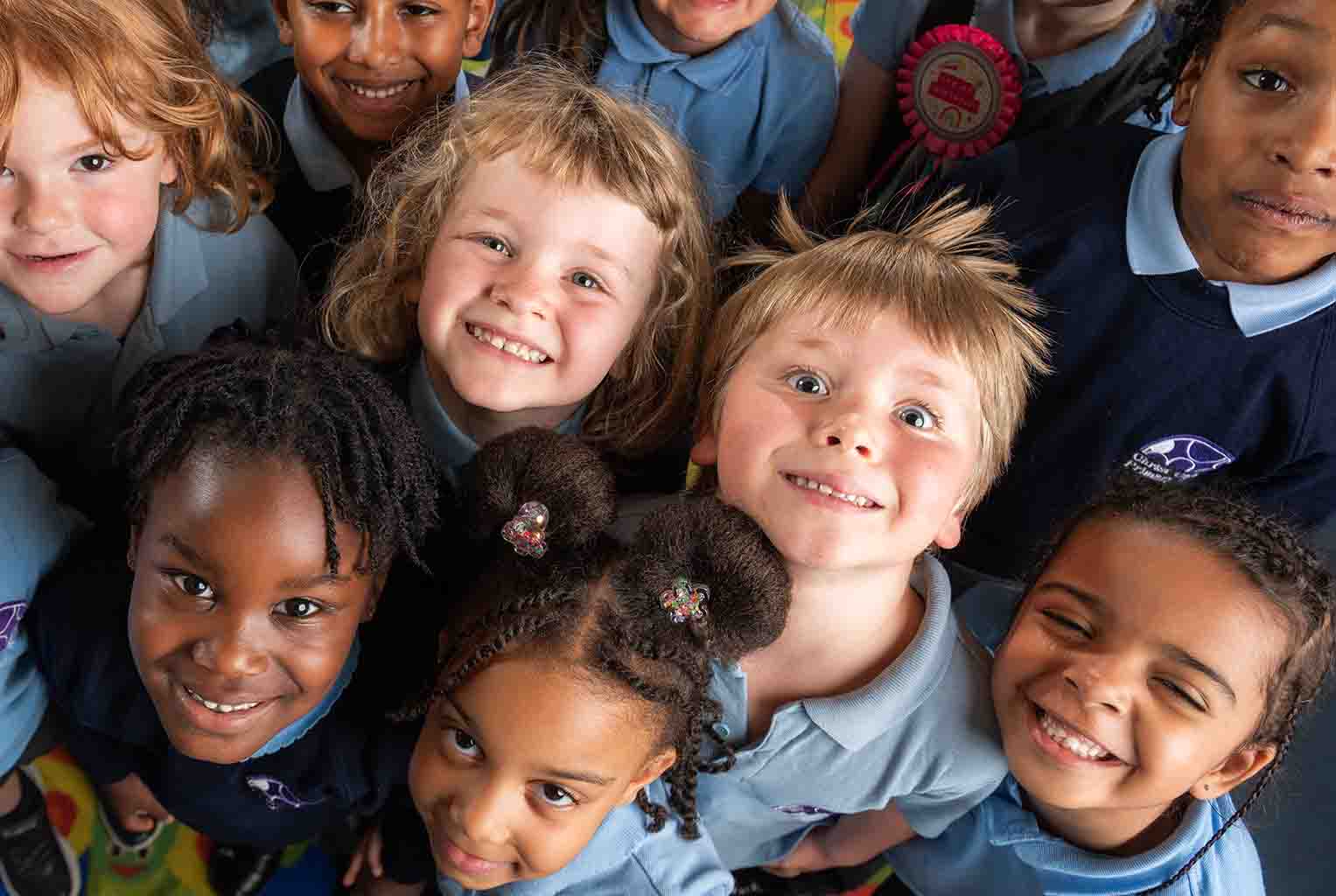 Happy pupils in a school classroom setup